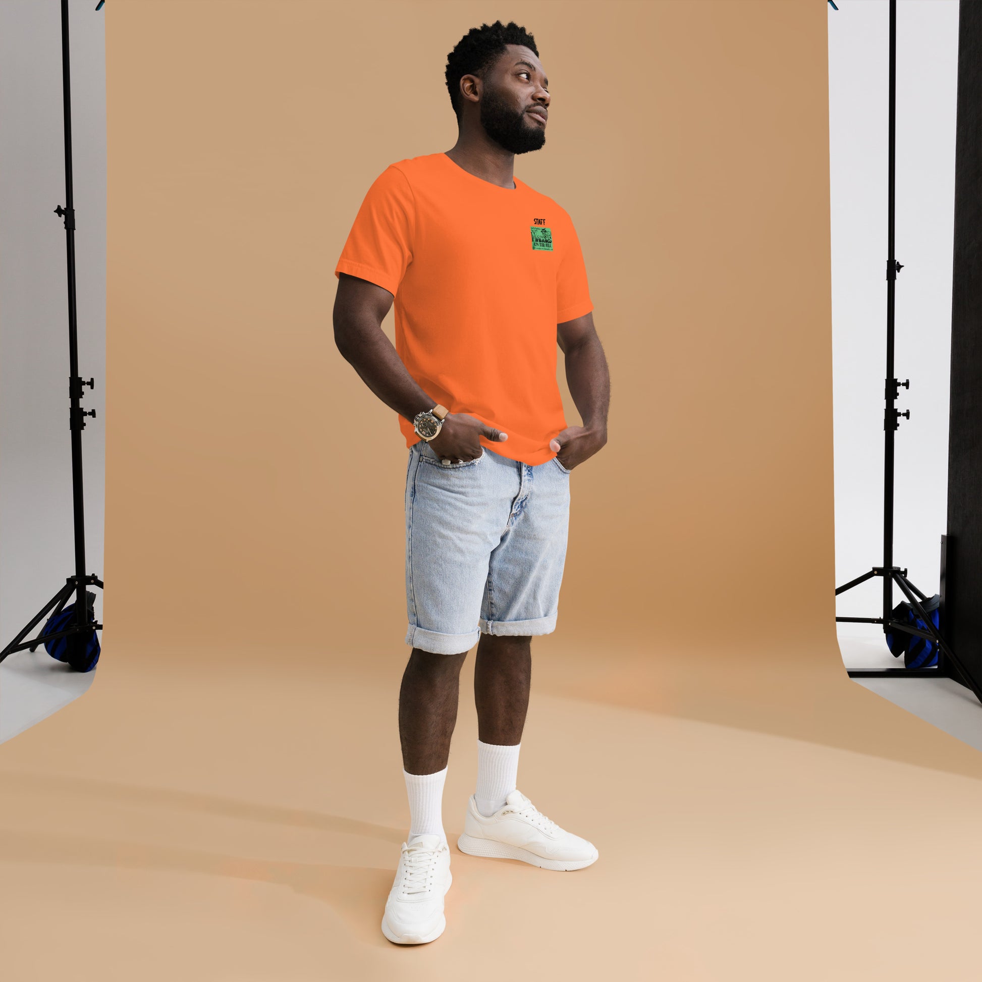 Orange unisex T shirt that says 'Maggie's on the Hill - Staff'