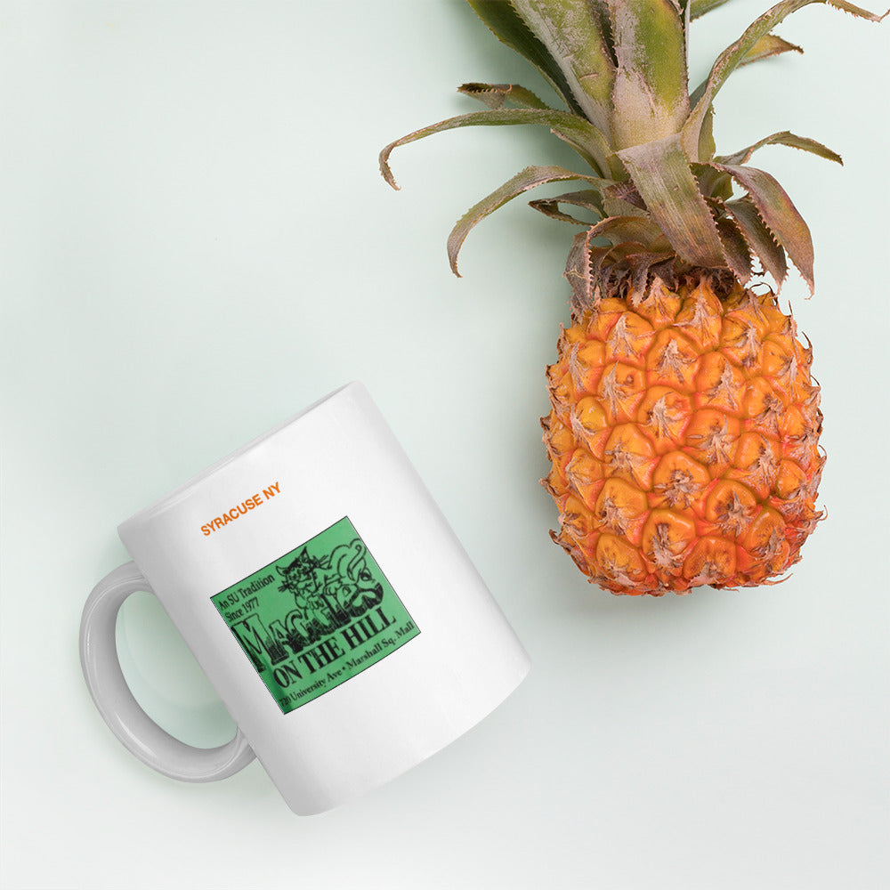 White mug says 'Syracuse NY,  Maggie's on the Hill'  on two sides