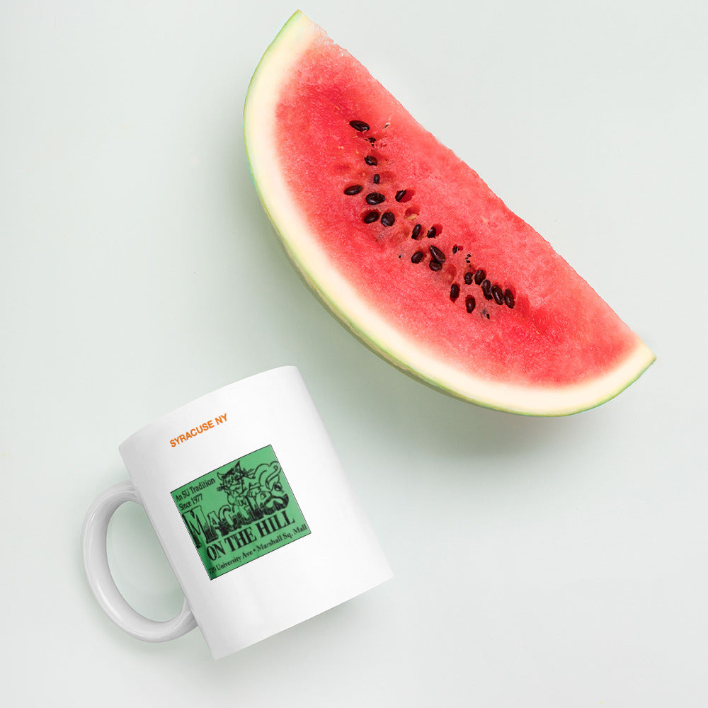 White mug says 'Syracuse NY,  Maggie's on the Hill'