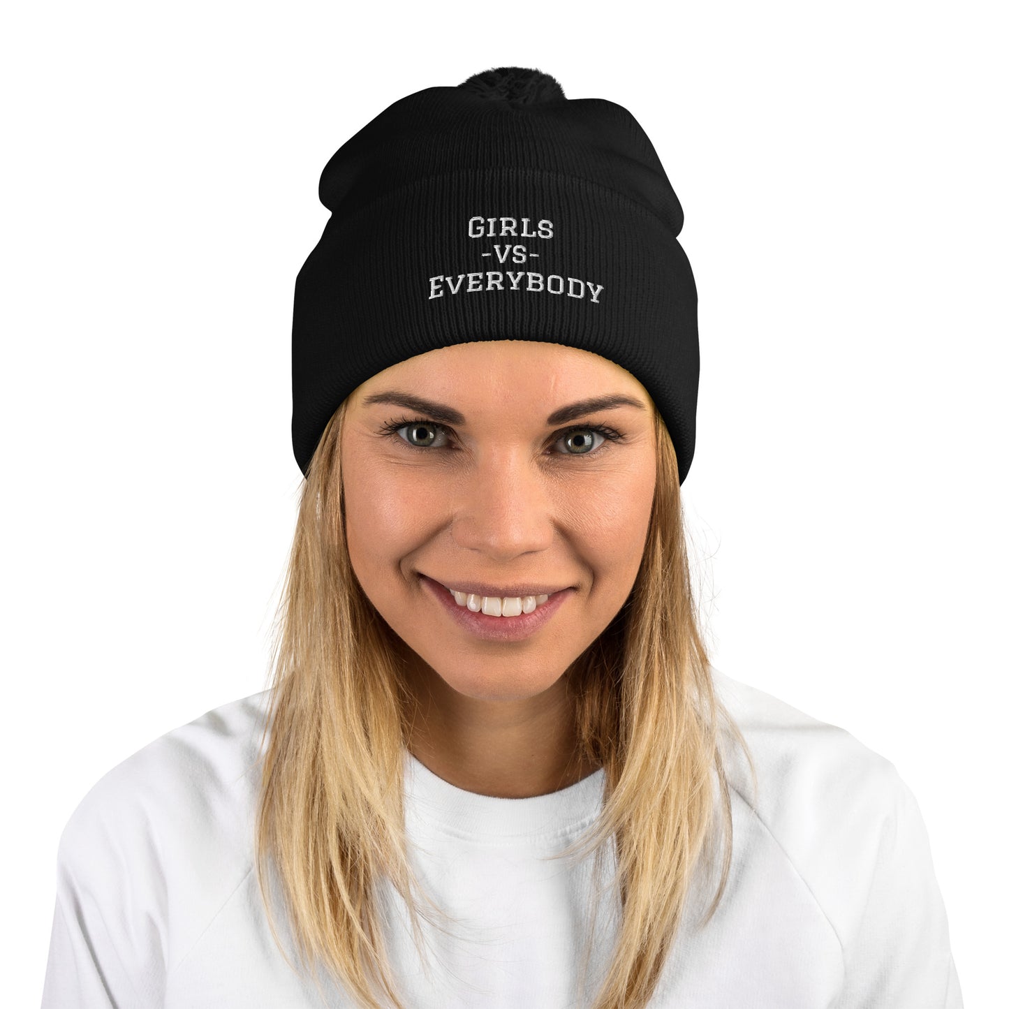 Black winter beanie hat with pom pom on top, embroidering reads: "Girls VS Everybody"