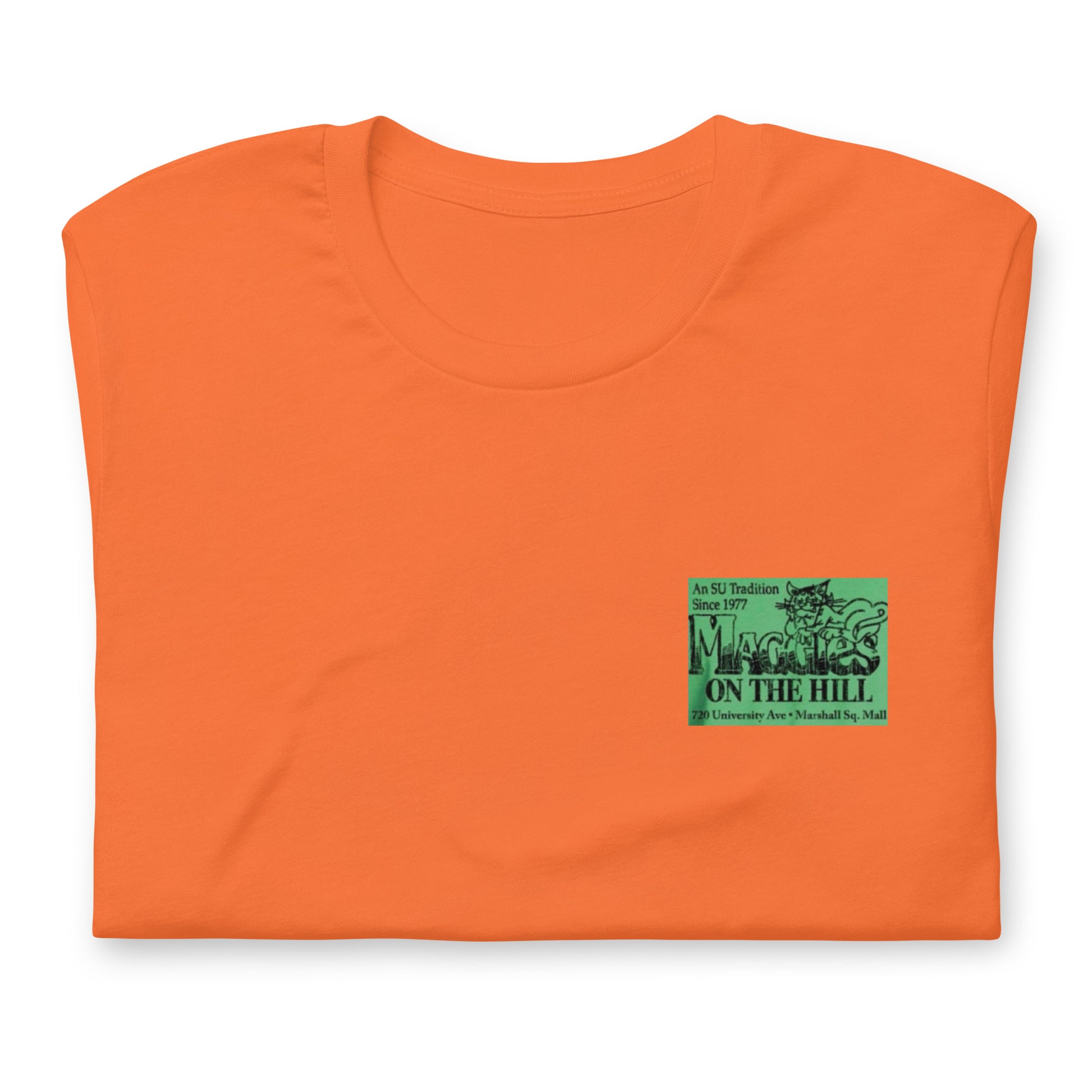 Orange tee shirt that says 'Maggie's on the Hill' in green and black