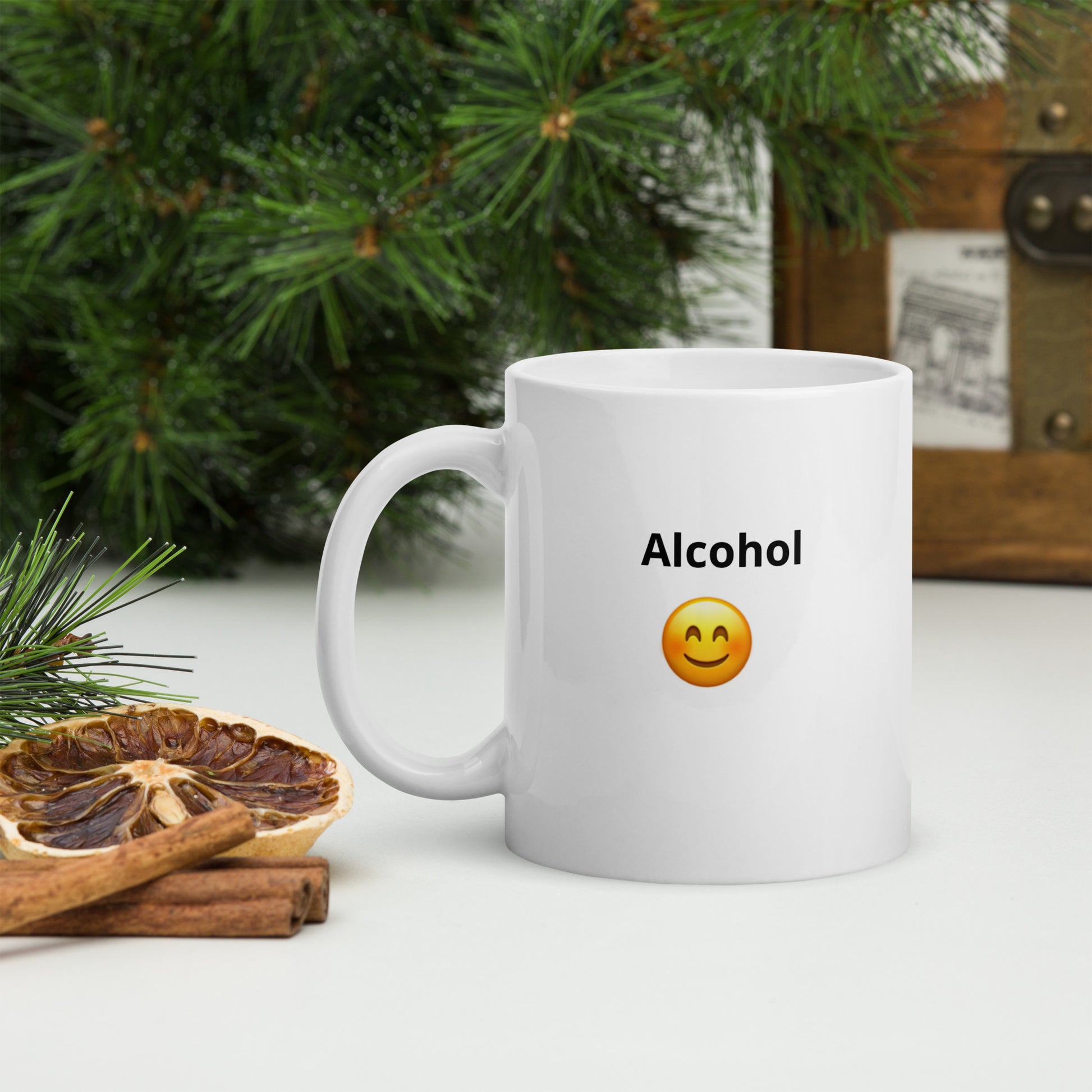 White ceramic mug with a happy face says  "Alcohol" on both sides