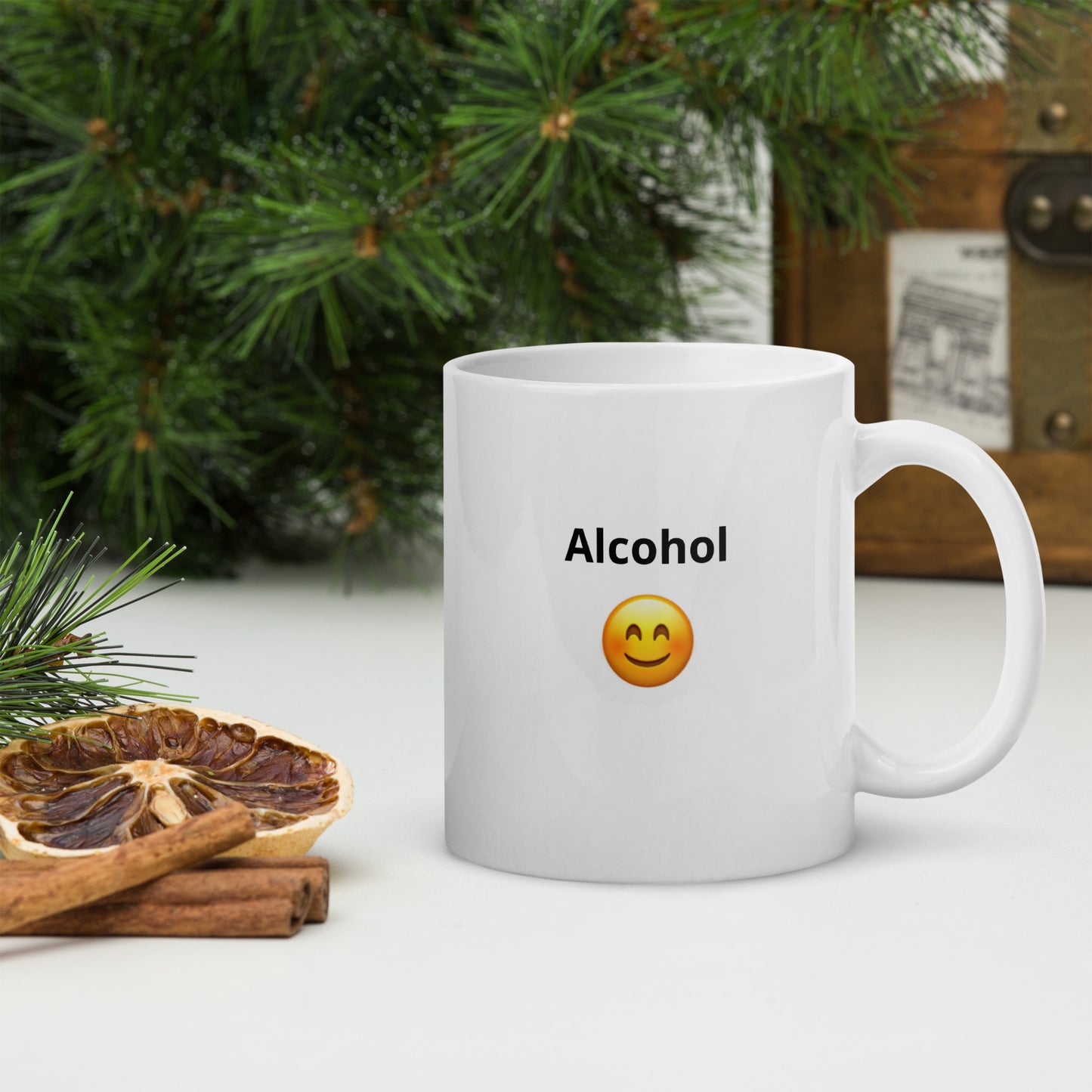 White ceramic mug with a happy face says  "Alcohol"